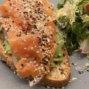 Avocado Toast with Salmon, everything bagel seasoning and side salad