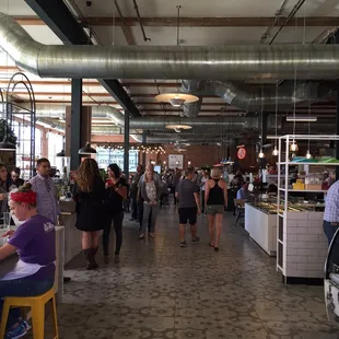 people walking around the counter