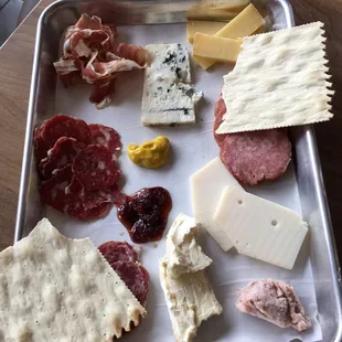 a variety of cheeses and meats