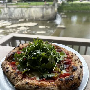 a pizza on a plate on a table