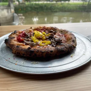 a pizza on a plate on a table