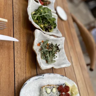 Sushi, green beans, and salad