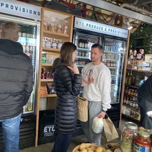 people shopping in a grocery store