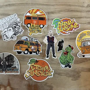 Check out our merchandise! We sell stickers, tees, hats, and hoodies designed by local artist @suplexchewie. Follow him on Instagram!