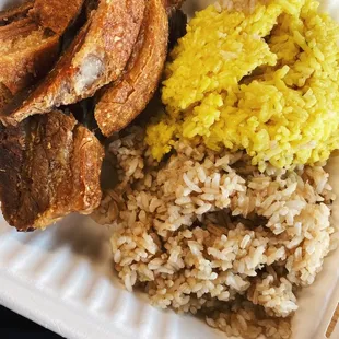Fried pork belly with garlic and java rice on the side.