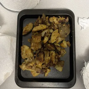 a tray of fried potatoes