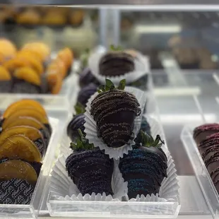 Chocolate covered strawberries, oranges and marshmallows.