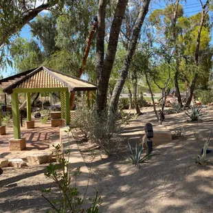 a gazebo surrounded by trees