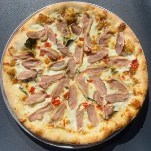 a pizza with meat and vegetables