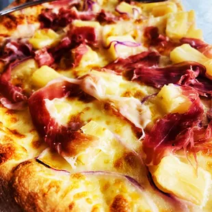 a ham and pineapple pizza