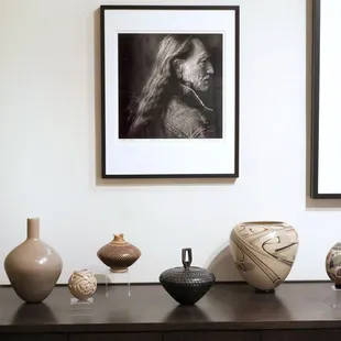 Annie Leibovitz's photo of Willie Nelson above Mata Ortiz Pottery in the Classic Room at Etherton Gallery.