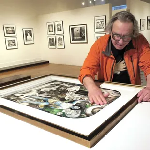 Joel-Peter Witkin hand buffing his encaustic piece.
