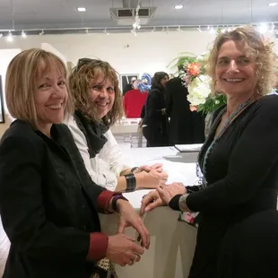 Having fun at a gallery opening.