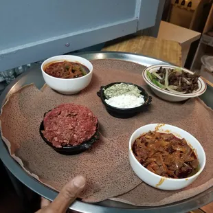 a person holding a plate of food