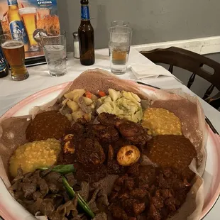 Combo 1: Spicy chicken, lamb, lentils. Added beef tins and all served on njere.