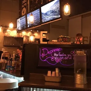 a neon sign on the counter