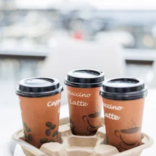 three cups of coffee on a tray