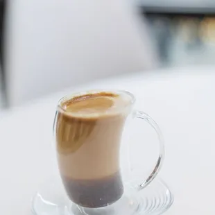 a cup of coffee on a saucer