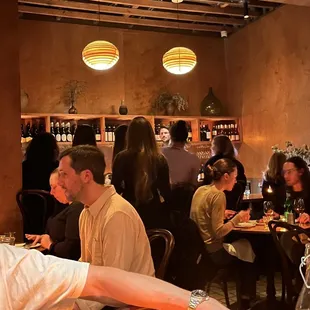 a man sitting at a table in a restaurant