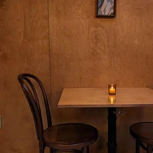 a table and two chairs in a restaurant