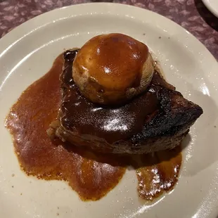 Steak with mushroom cap and Demi glaze on top. The steak was soooo tender and the baked potato I got was perfectly cooked!