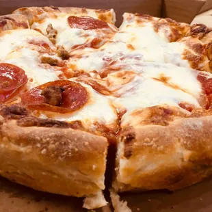 a half eaten pizza in a box