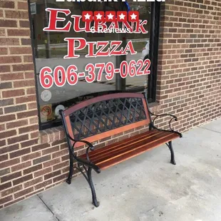 a bench in front of a window