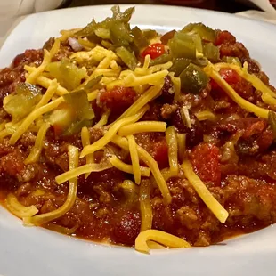 Bowl of Chili with jalapeños and cheese