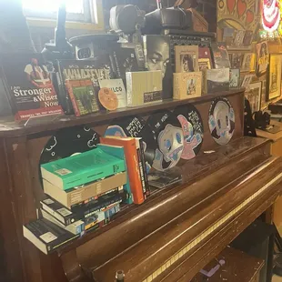 Old piano, books and memorabilia
