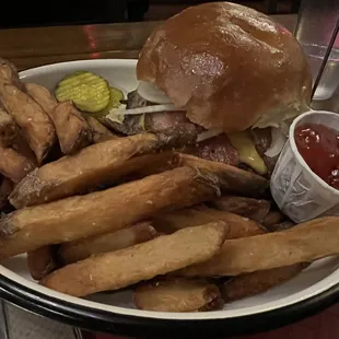 Tasty burger with fries