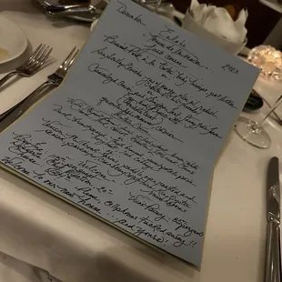 a handwritten menu on a table