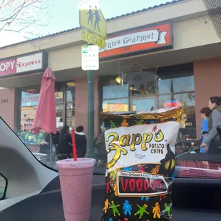 a bag of chips and a drink