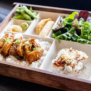 a meal in a wooden tray