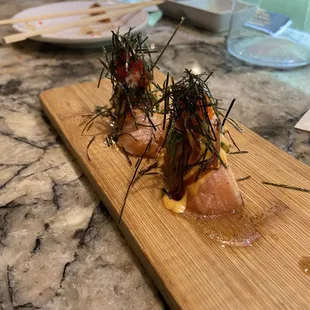 two sushis on a cutting board