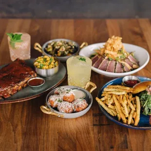 a variety of food items on a wooden table