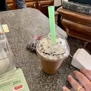 a cup of coffee with whipped cream