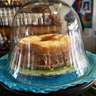 a cake under a glass dome