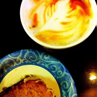 a plate of food and a cup of coffee