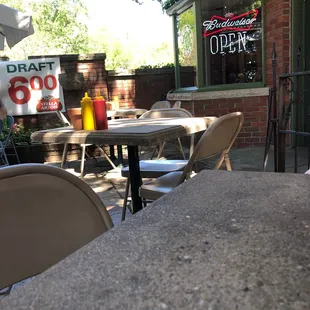 a table and chairs outside a restaurant