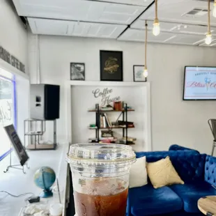 a person holding a cup of coffee