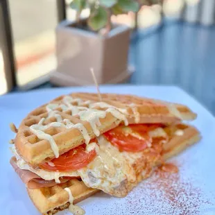Italiano - Waffle filled with homemade pesto. eggs prosciutto, and melted mozzarella