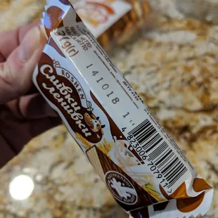 a person holding a chocolate bar