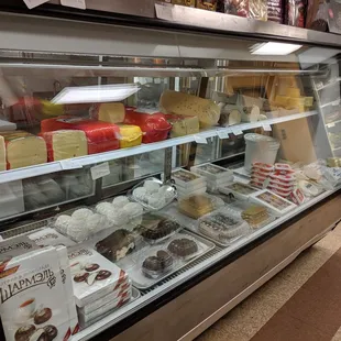 a display of cheeses and pastries