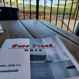 a menu on a wooden table