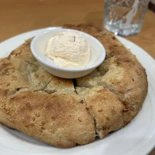 a plate of food with a bowl of dip