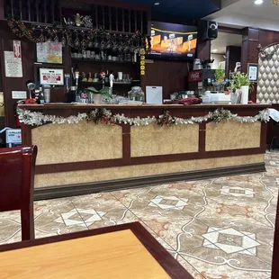 a bar in a restaurant with a christmas decoration