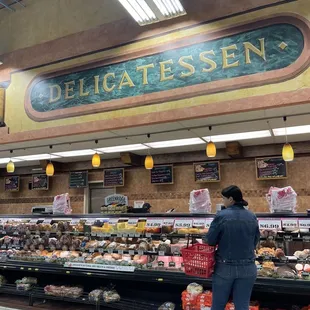 a woman shopping in a deli