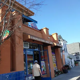 a woman walking down the sidewalk