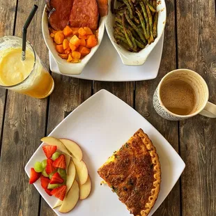 two plates of food and a cup of coffee