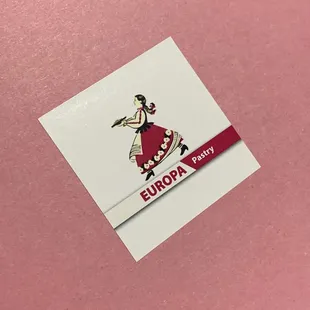 a sticker on a pink surface